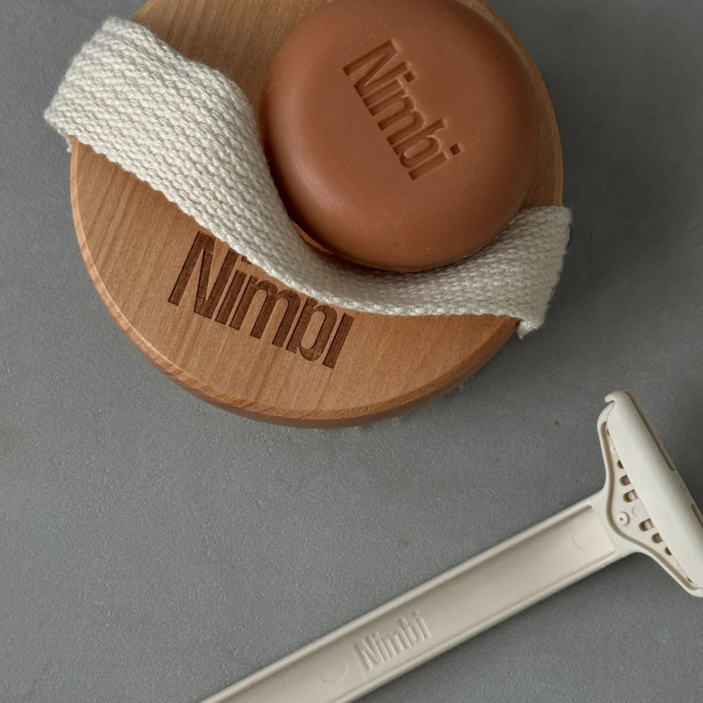 https://d3vlxf0ngetfml.cloudfront.net/compressed/blog-media/original_images/NIMBI-Shea-Butter-Shave-Foam-Puck.jpg