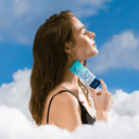 https://d3vlxf0ngetfml.cloudfront.net/compressed/blog-media/original_images/Vacation_CrystalGel_ModelHoldingProductToNeck-CloudBG_2000x2000_Custom_w128.png
