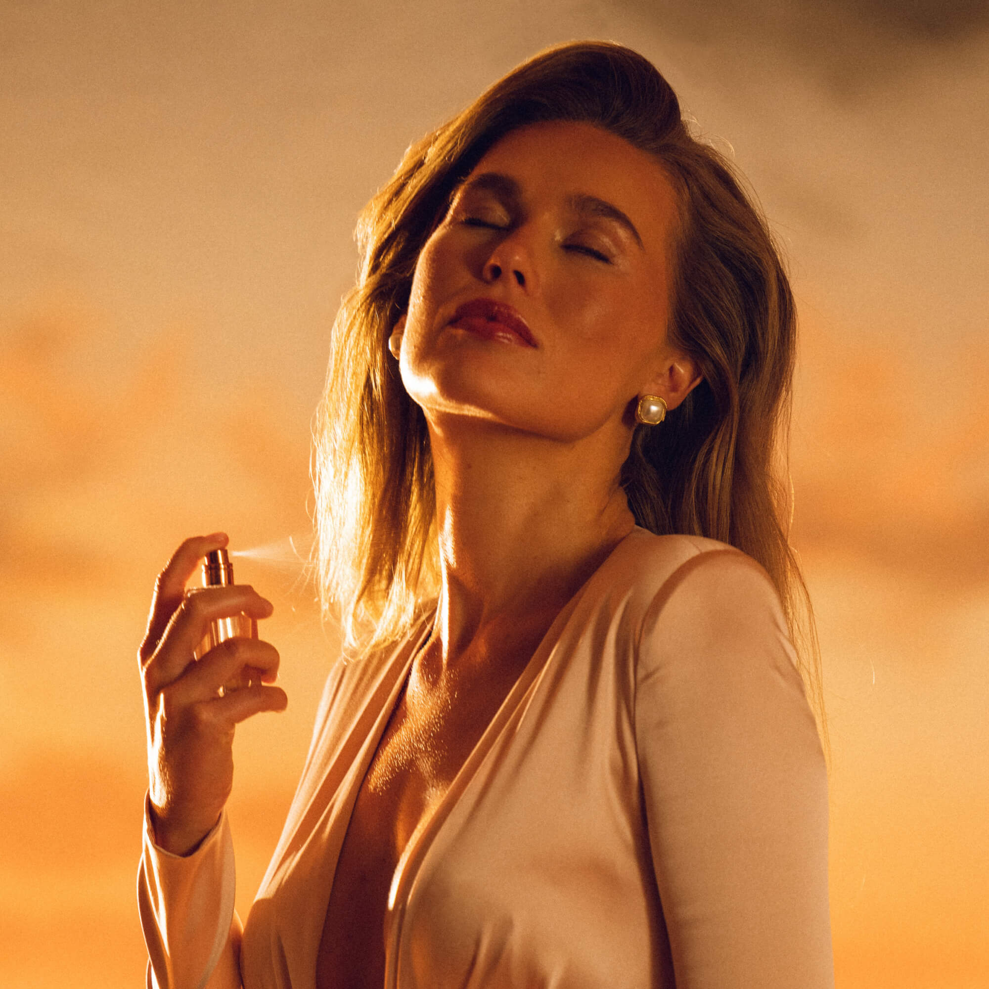 https://d3vlxf0ngetfml.cloudfront.net/compressed/blog-media/original_images/Vacation_GrandCuvee_FemaleModelSpraying_BoatDeckScene_2000x2000.jpg
