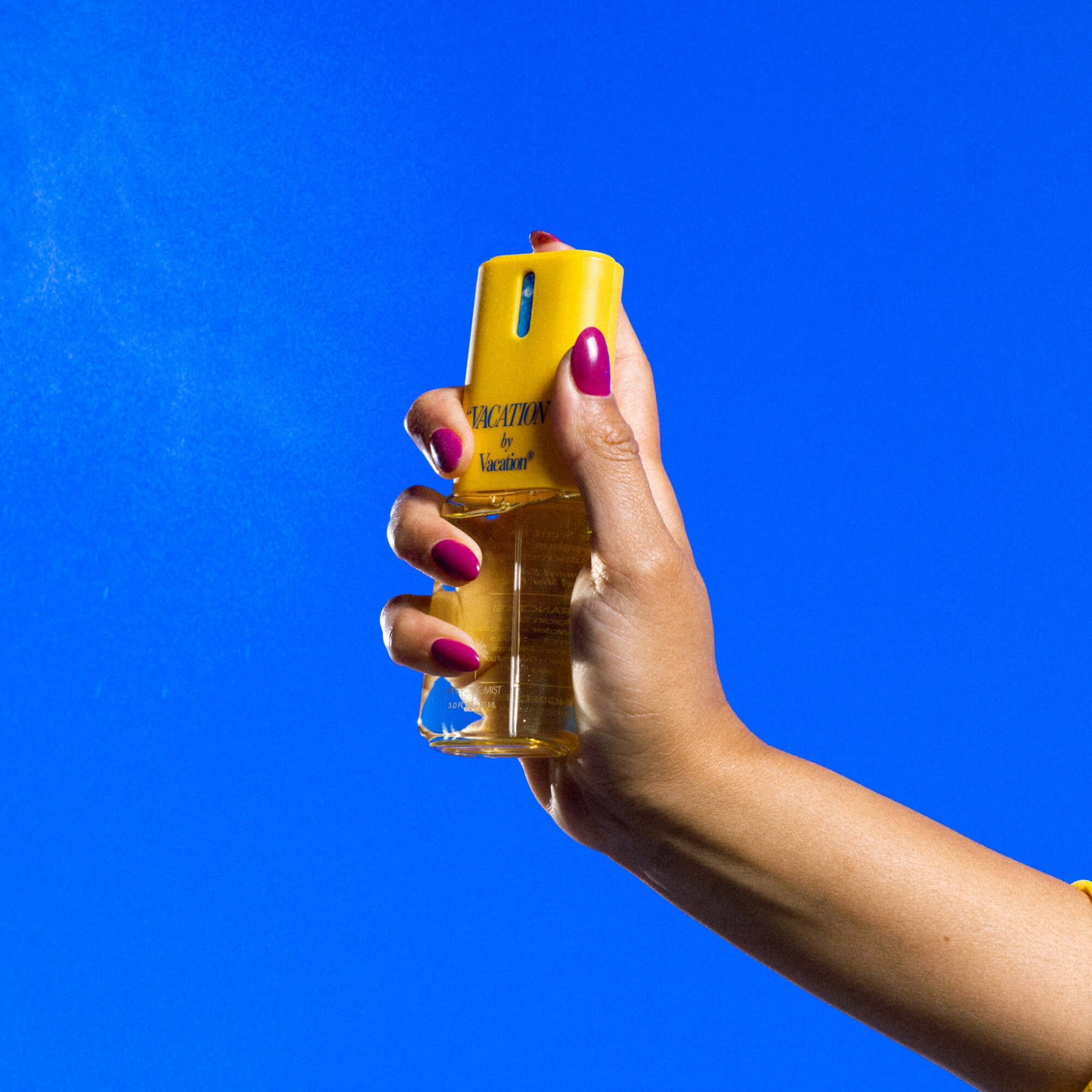https://d3vlxf0ngetfml.cloudfront.net/compressed/blog-media/original_images/Vacation__VACATION__BodyMist_ModelSpraying_BlueBG_2000x2000.jpg